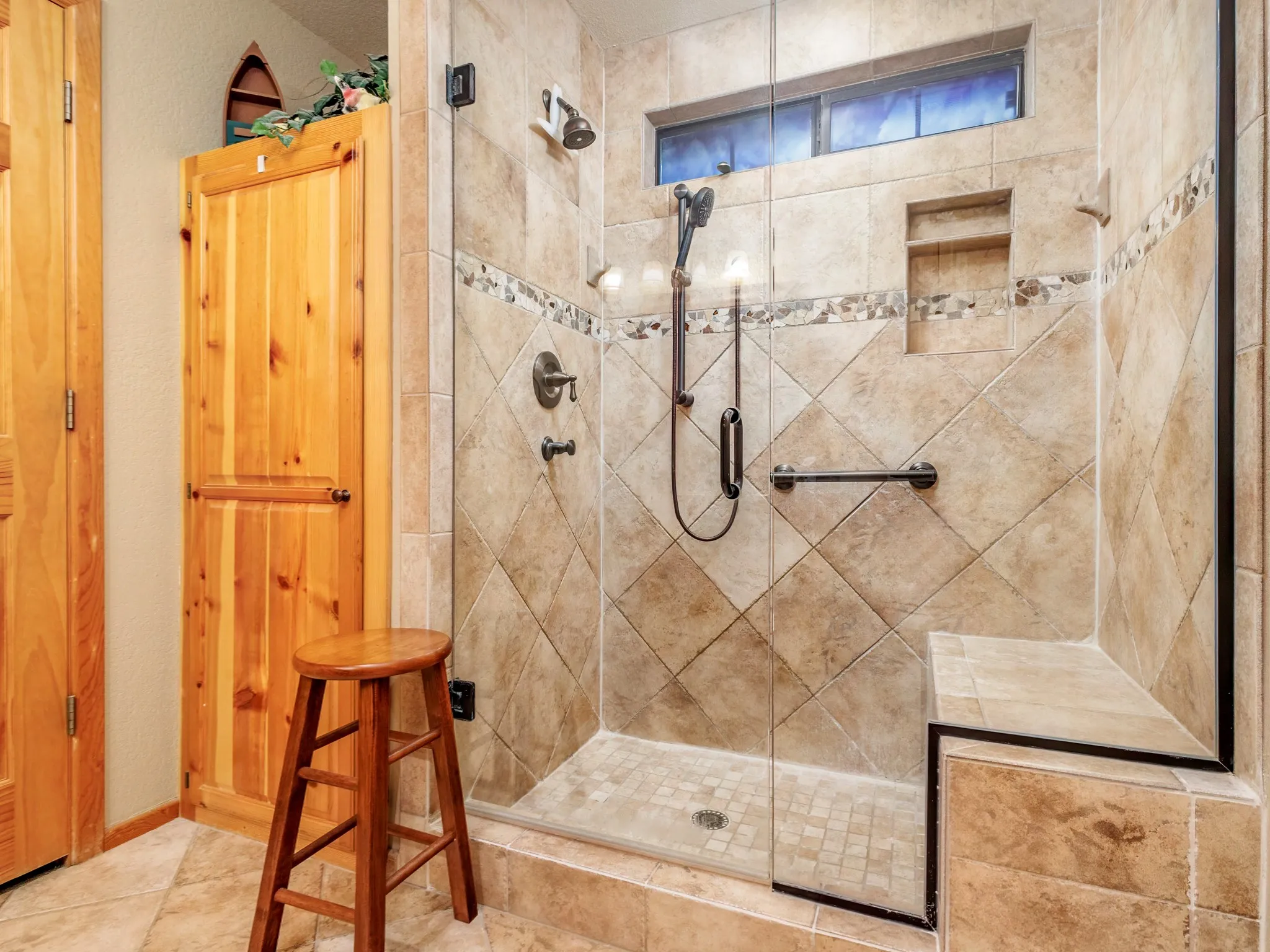 Full bathroom featuring a shower stall
