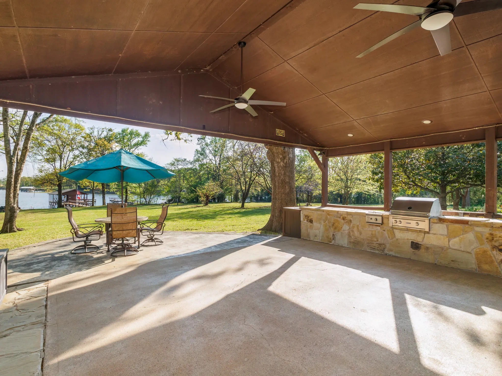 View of patio / terrace with ceiling fan and an outdoor kitchen / dining area