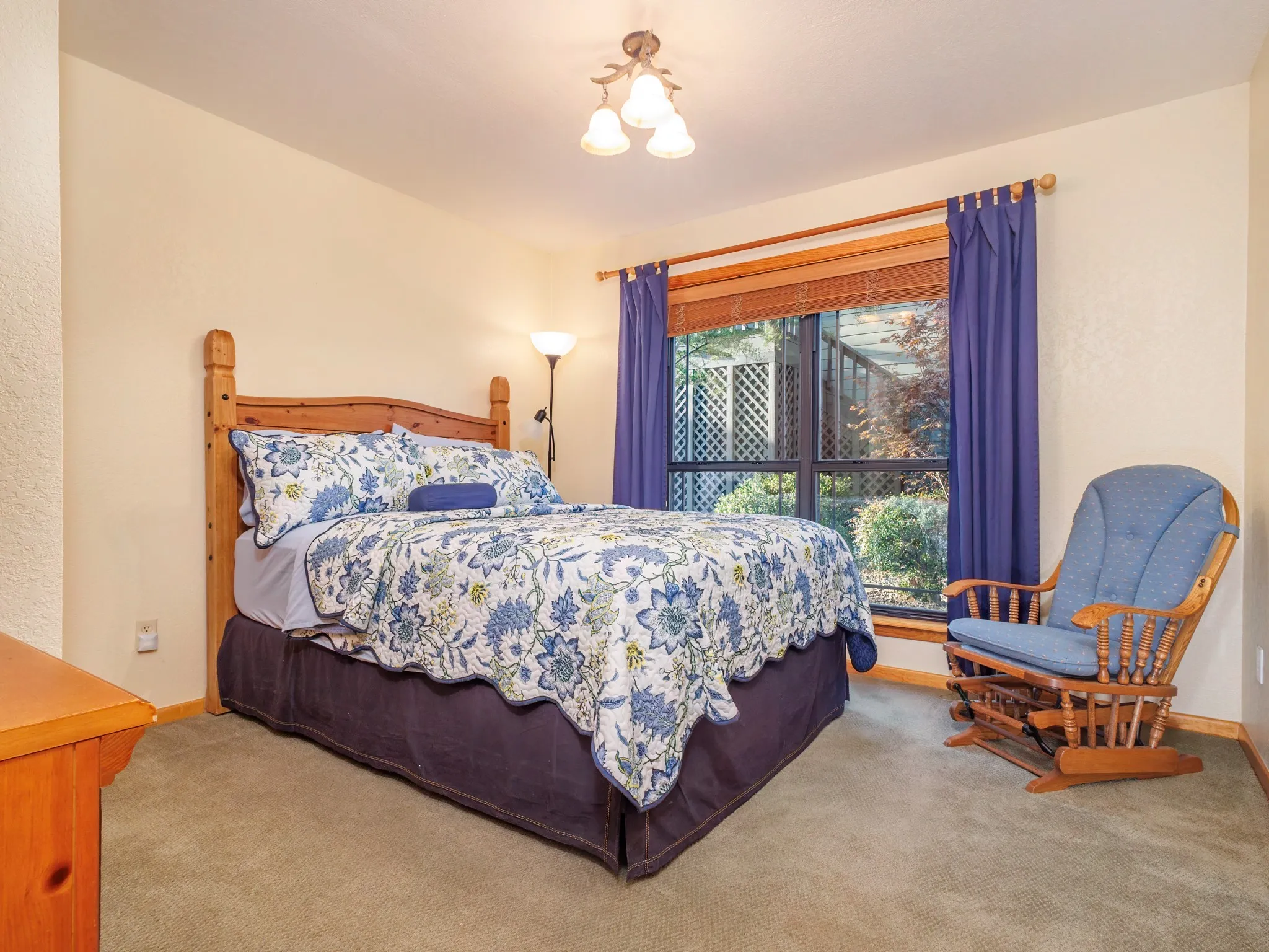 Guest Quarters Bedroom featuring light carpet