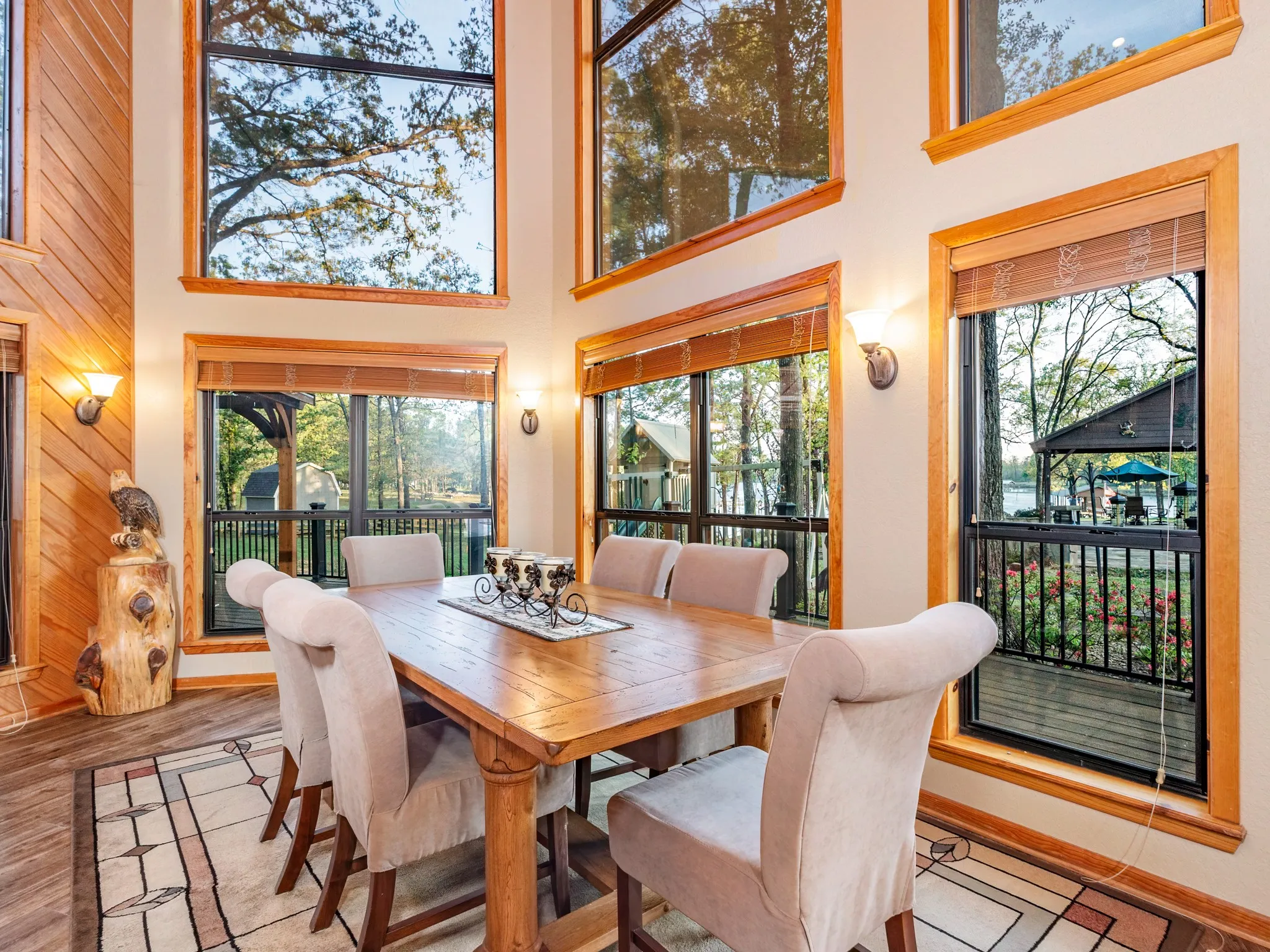 Dining room with a high ceiling and wood finished floors