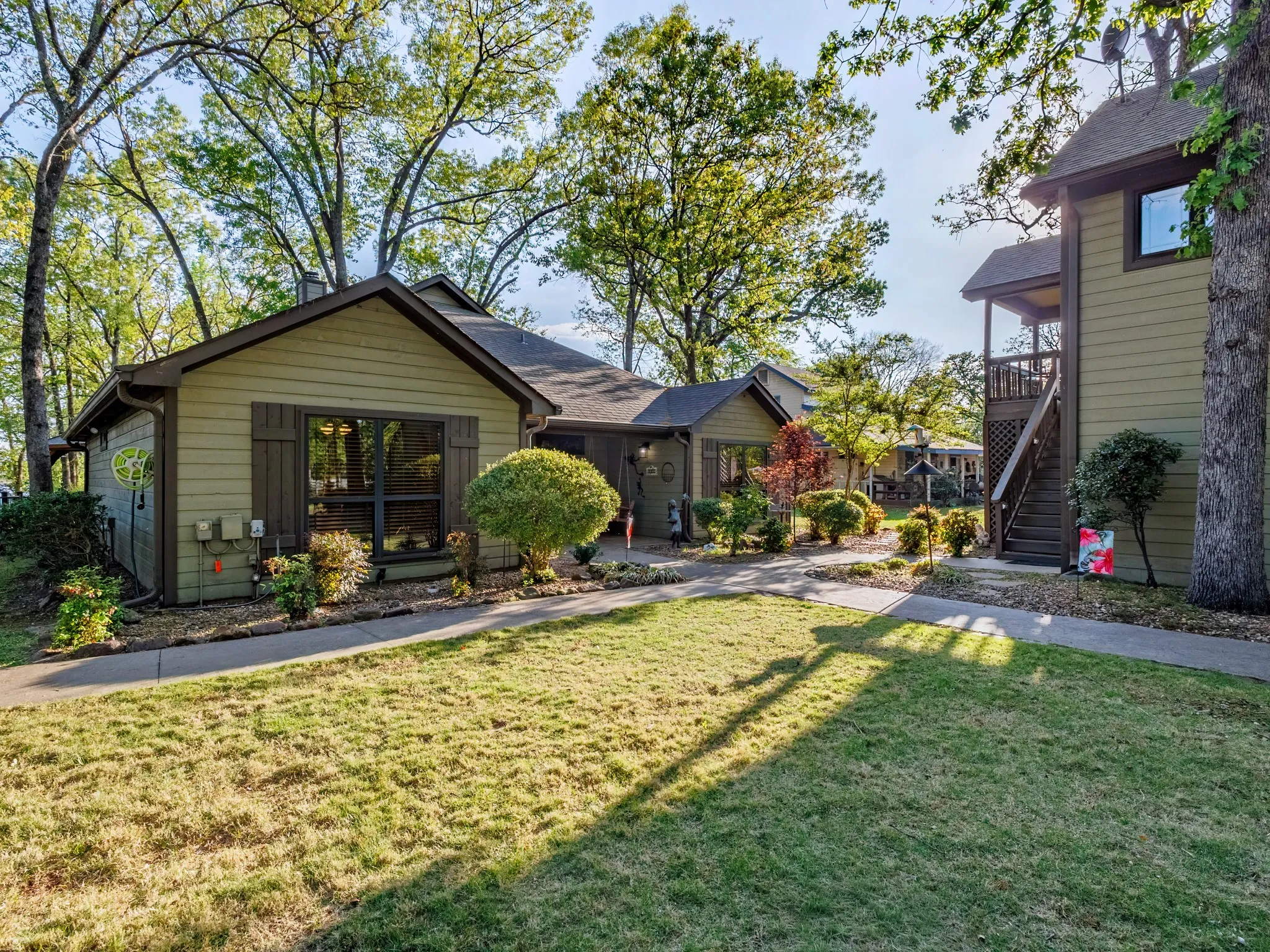Rear view of house with a lawn and stairs