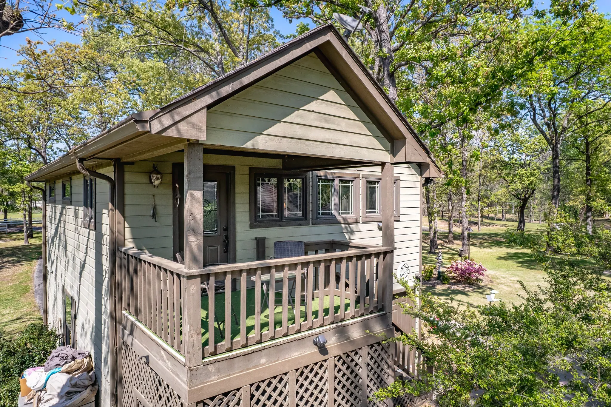 View of front of property with a wooden deck