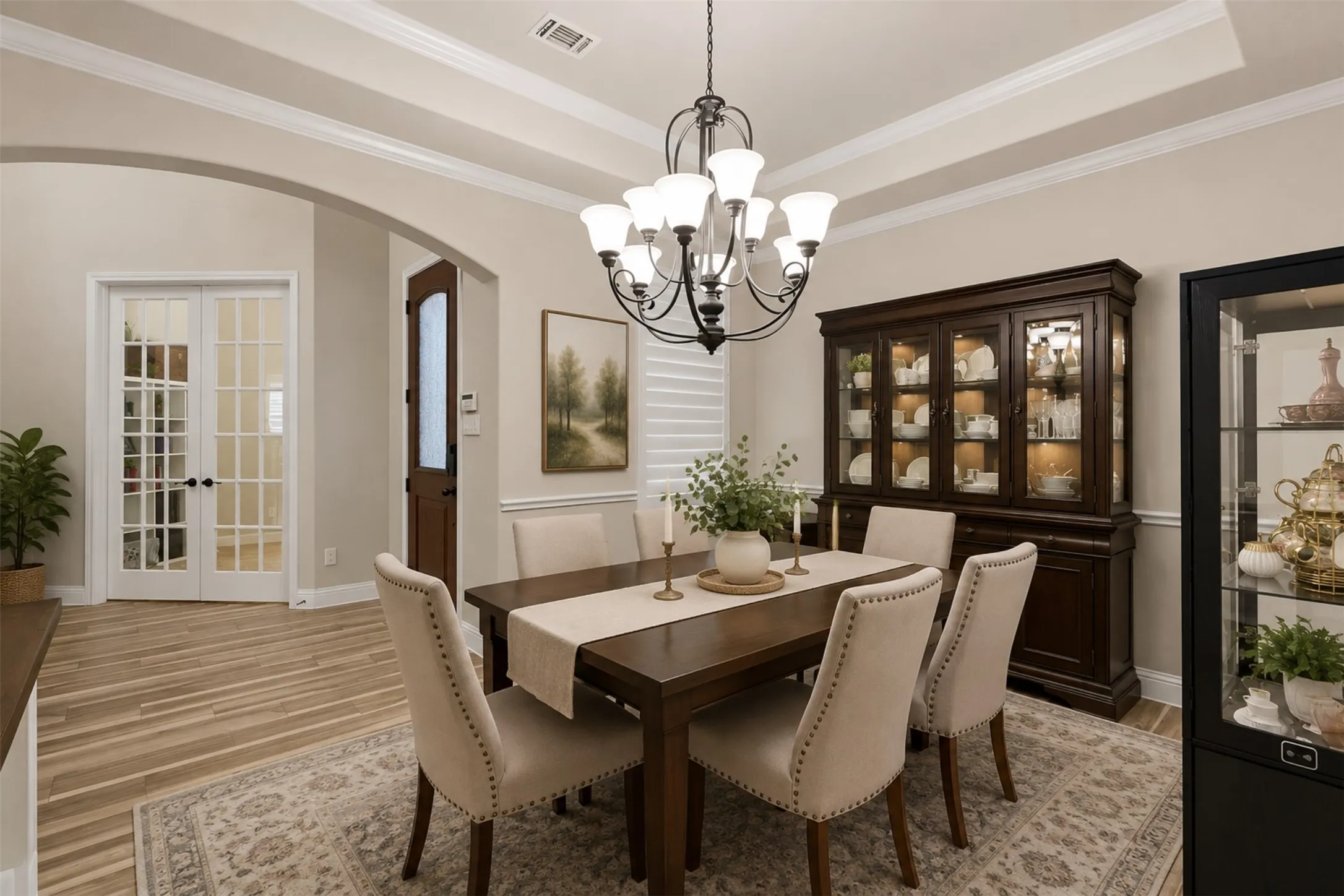 Virtually staged dining area looking into the entry