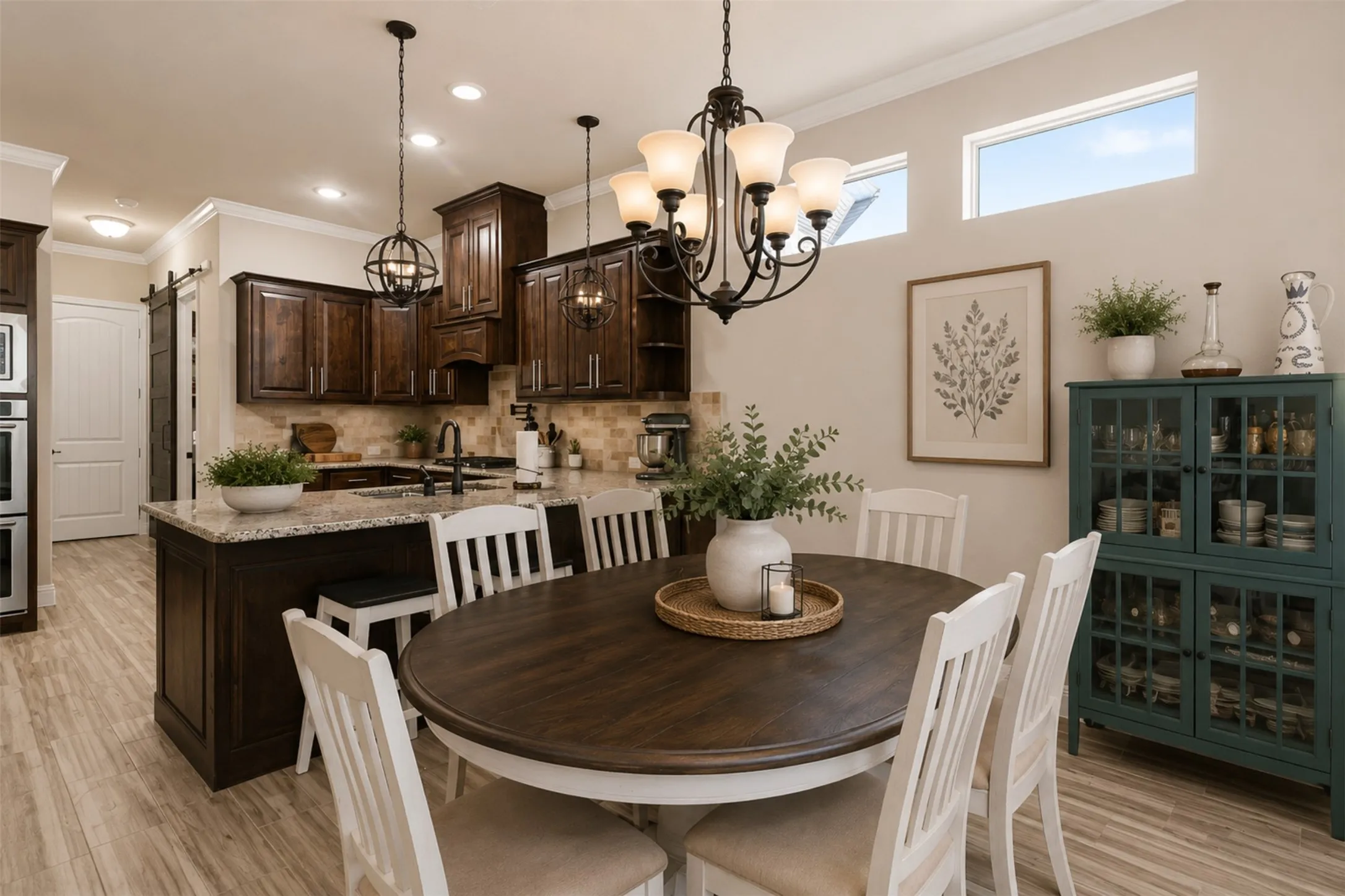 Virtually staged breakfast area looking into kitchen