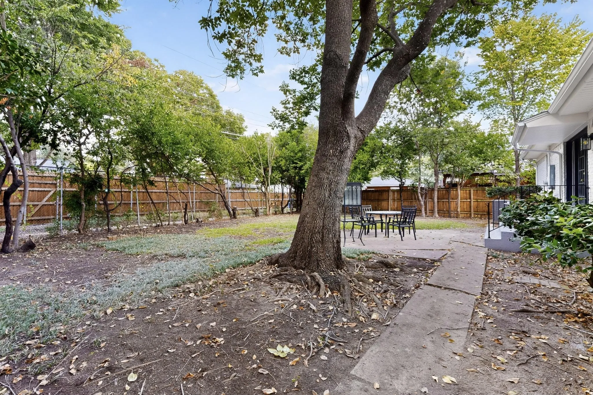 Fenced backyard featuring a patio