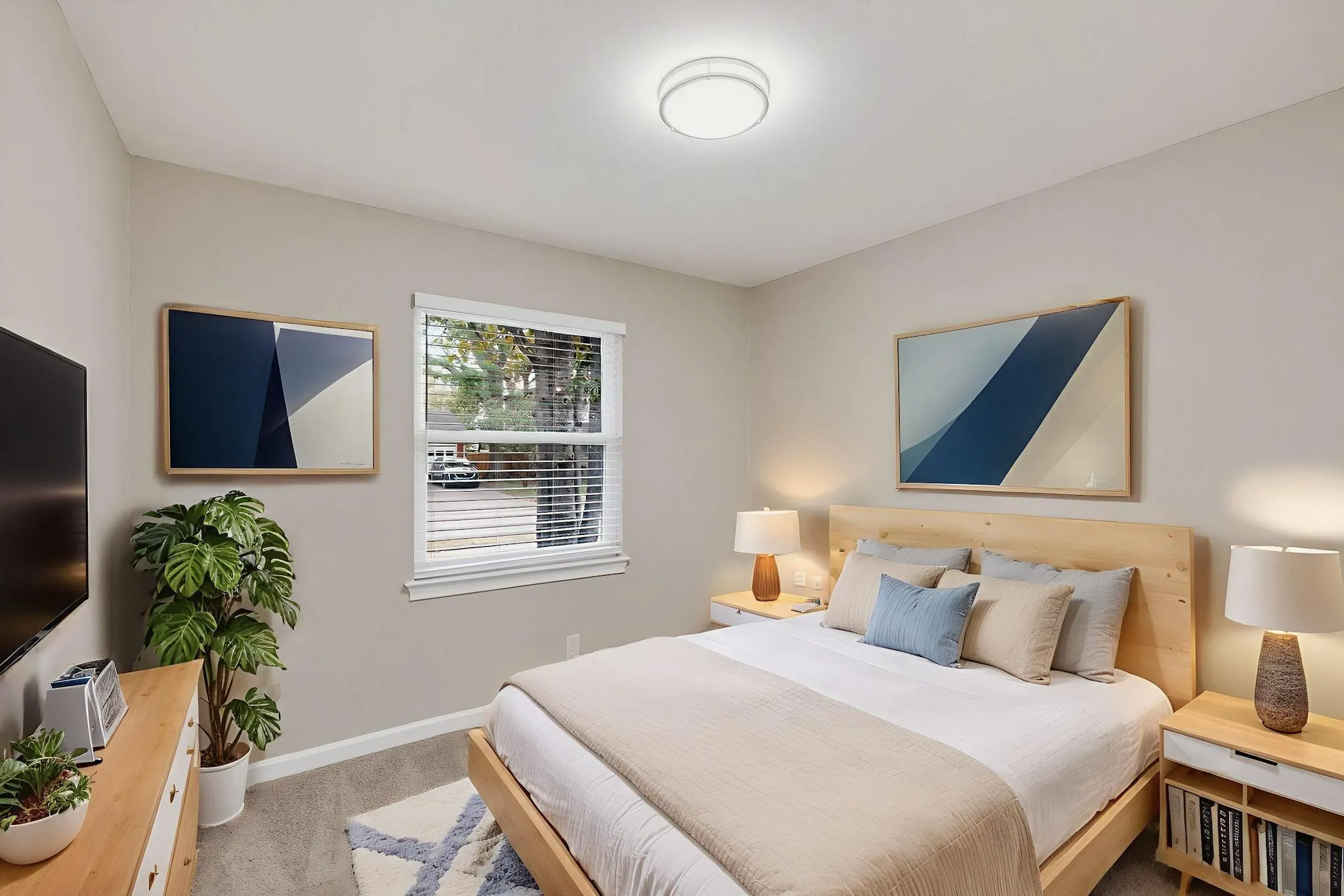 Bedroom featuring baseboards and light carpet