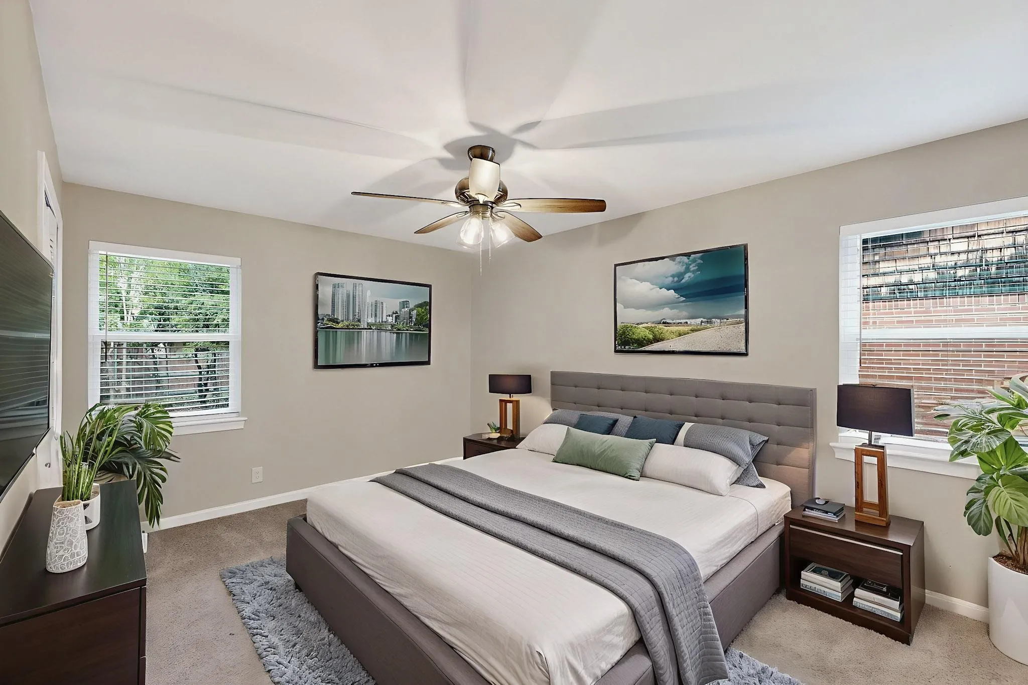 Bedroom featuring light colored carpet and a ceiling fan