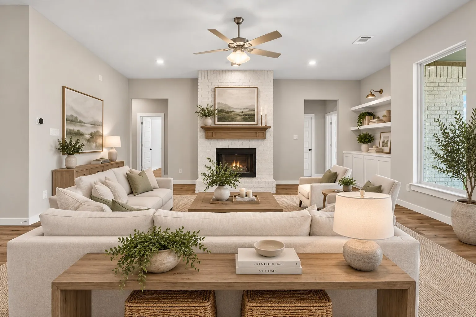 Spacious living area featuring wood-finish flooring, a white brick fireplace with a wood mantle, recessed lighting, and a ceiling fan
