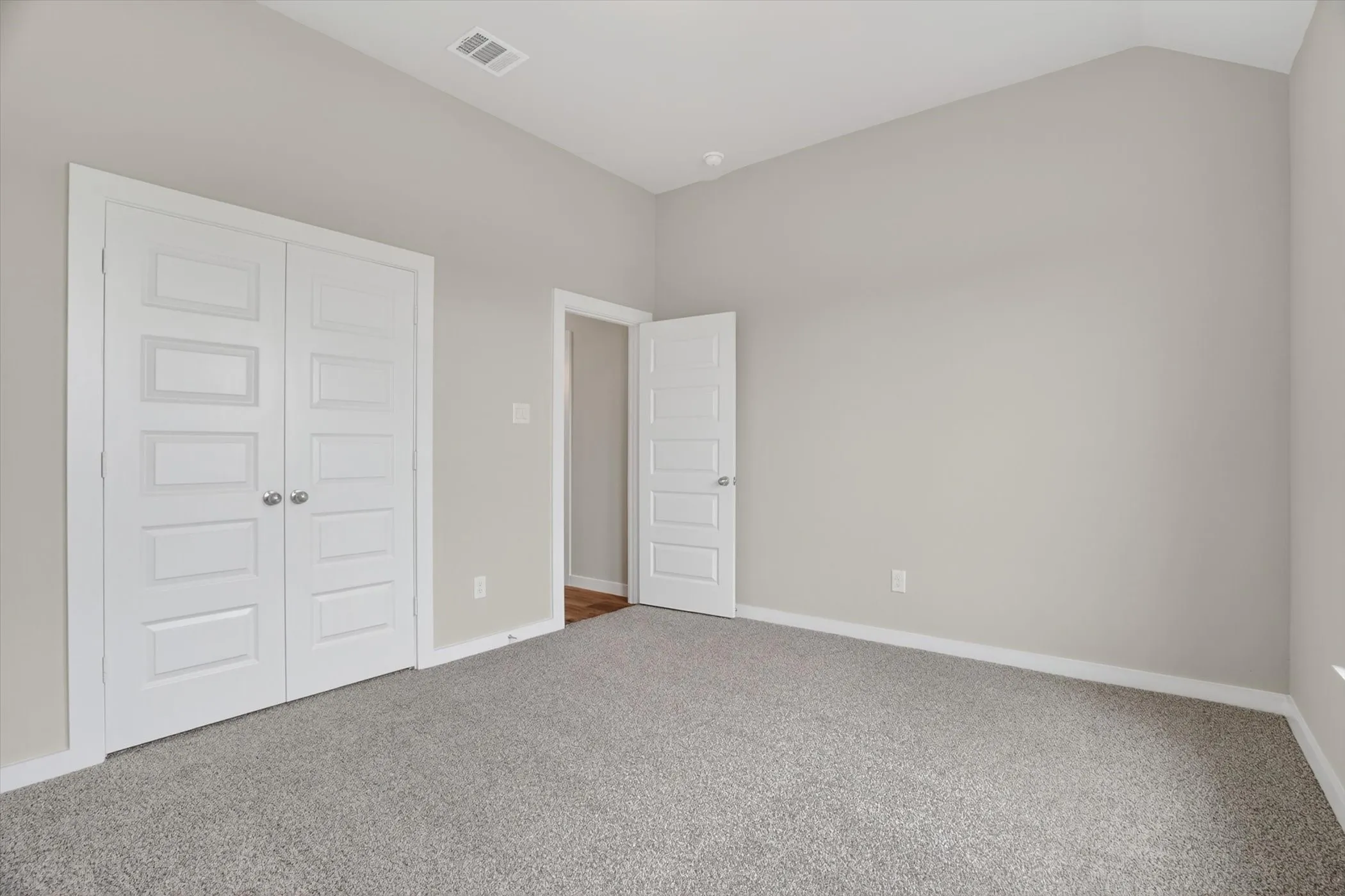 Secondary bedroom with double door closet and tall ceilings!