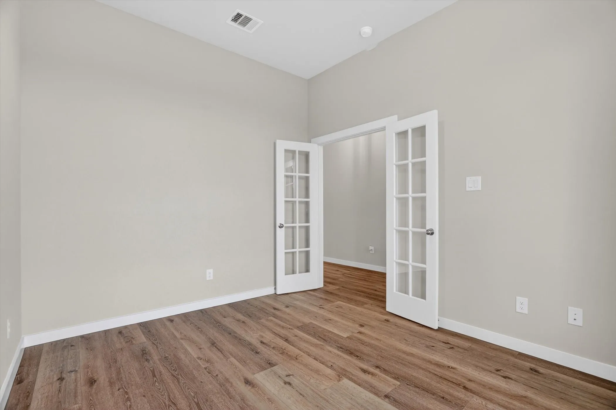 French doors leading into the office space from the entry space