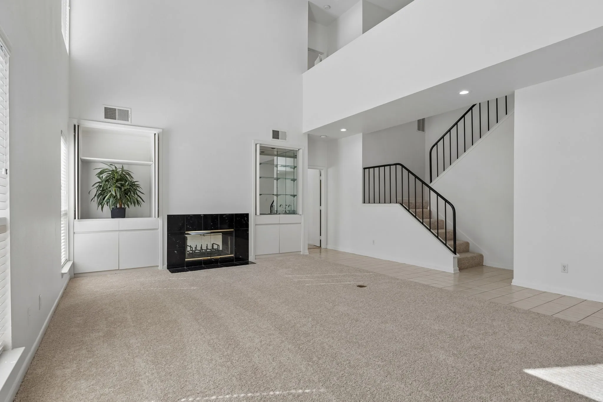 Unfurnished living room with wet bar and cabinet-Both can close
