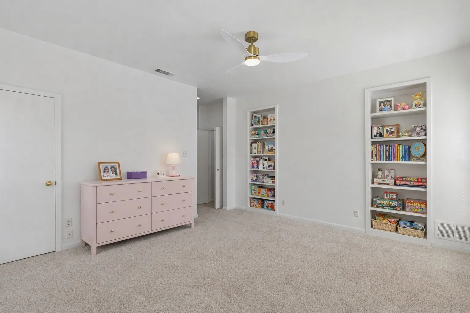 Bedroom featuring fan/light that has been Virtually staged
