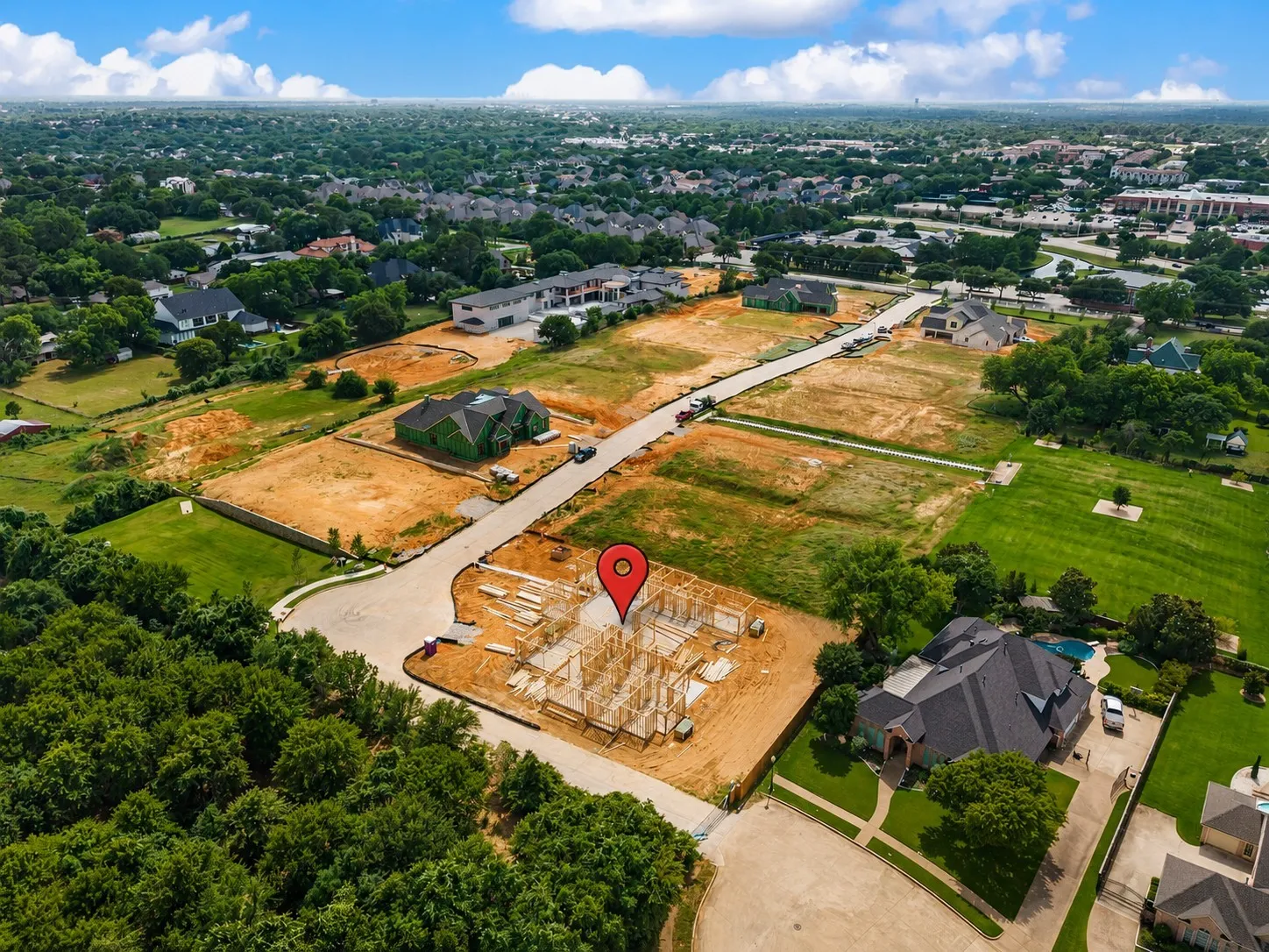 Aerial perspective of a developing residential area with multiple building sites