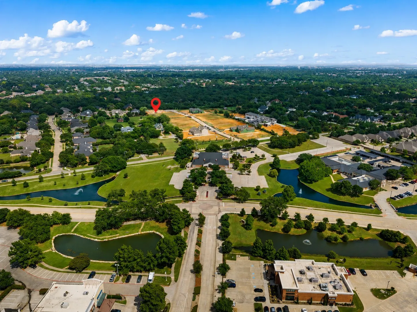 Aerial perspective showcasing a residential area with established homes and developing lots