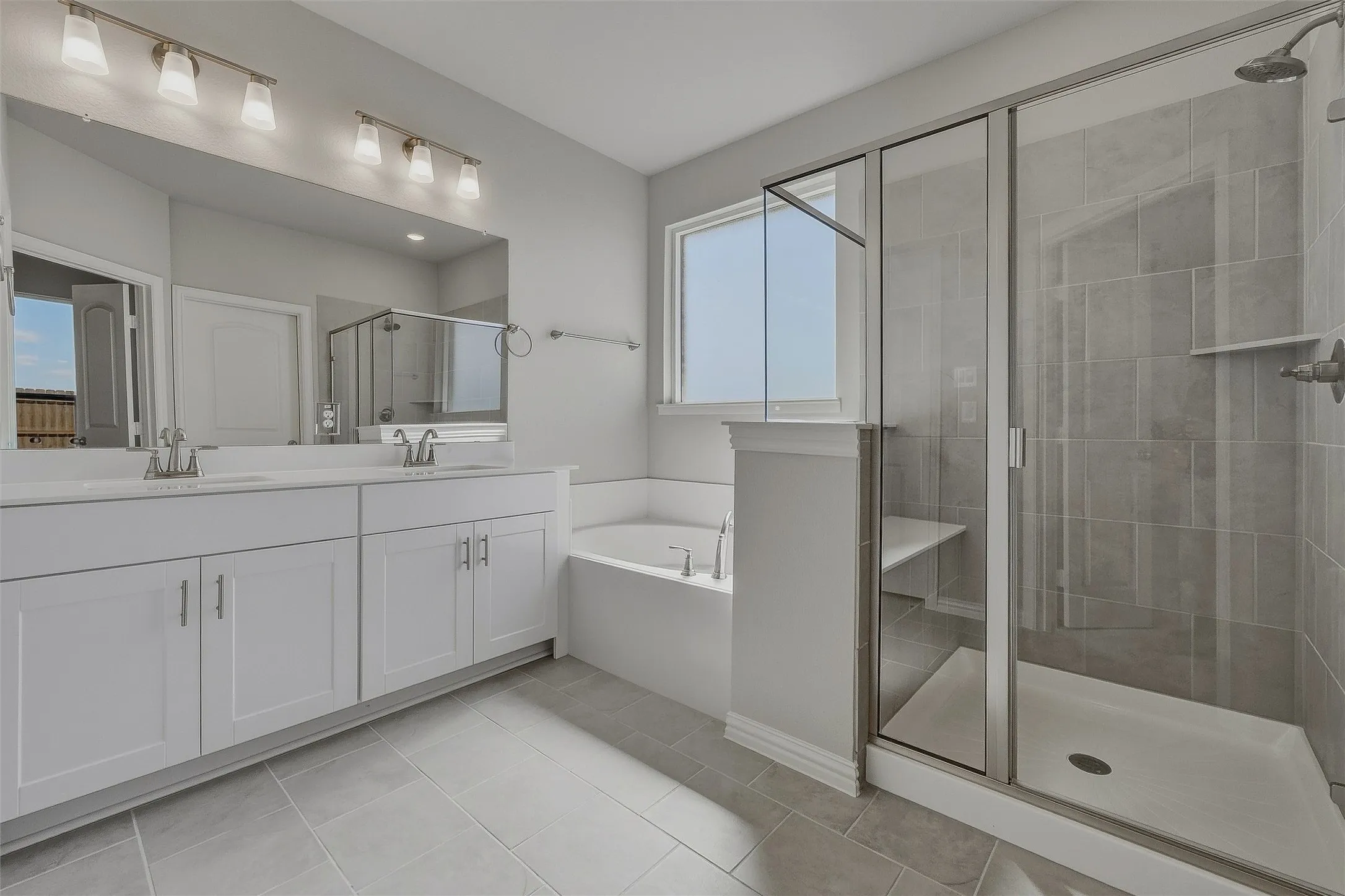 Dual vanity with white cabinetry and integrated sinks