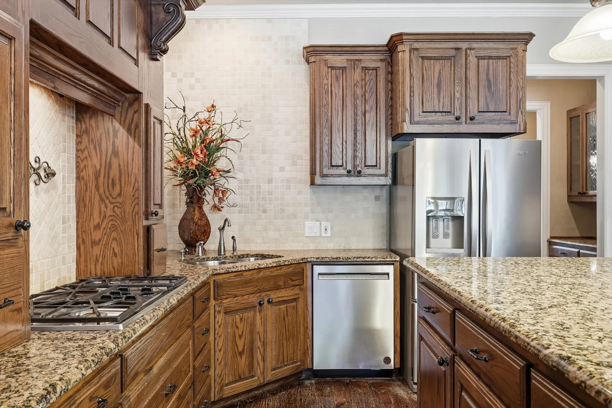 Custom wood cabinets, gas stove.