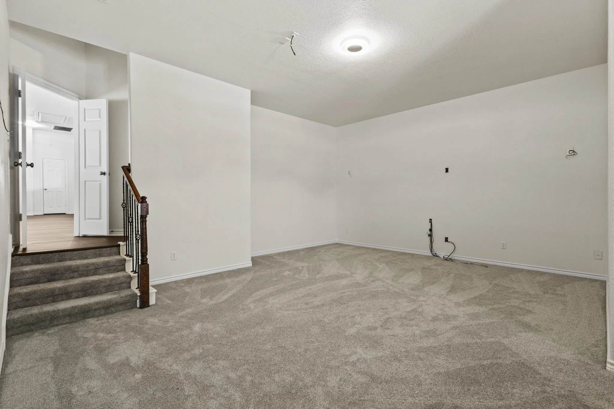 Bedroom with light colored carpet and ceiling fan