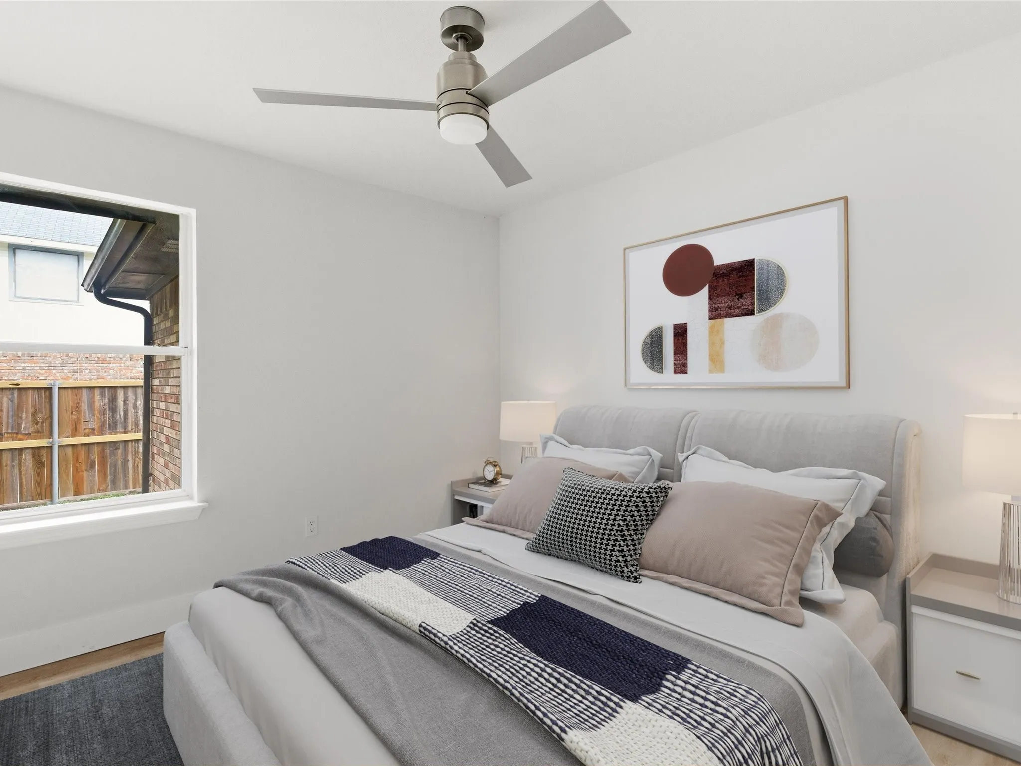 Bedroom featuring a ceiling fan and wood finished floors