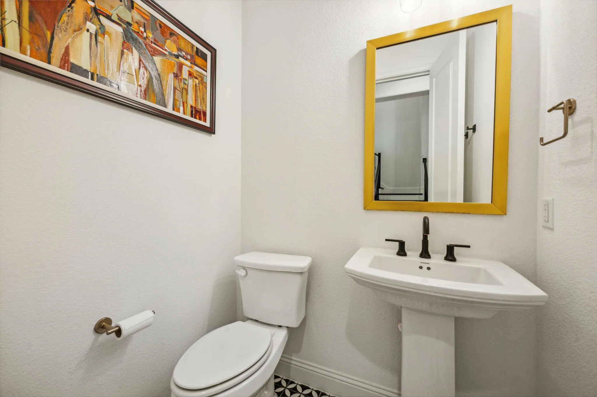 Bathroom featuring sink and toilet