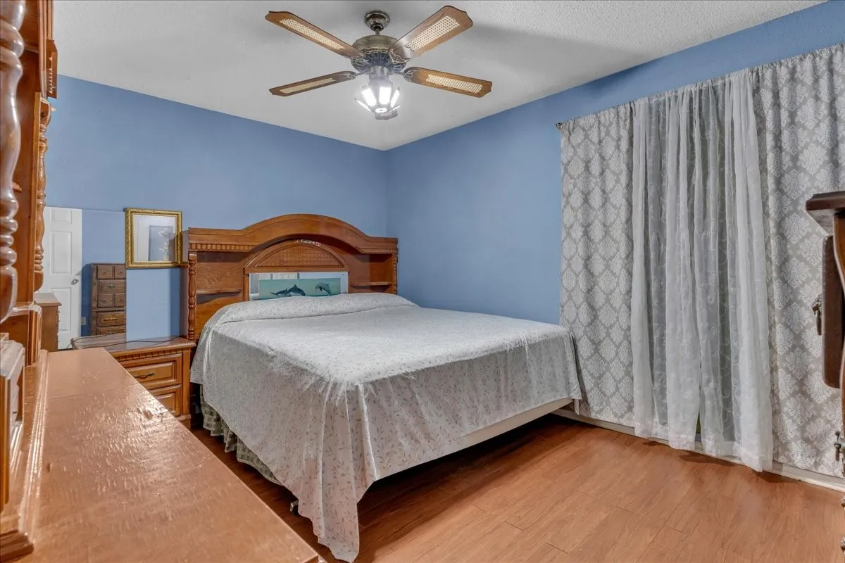 Bedroom featuring ceiling fan and light wood-style floors
