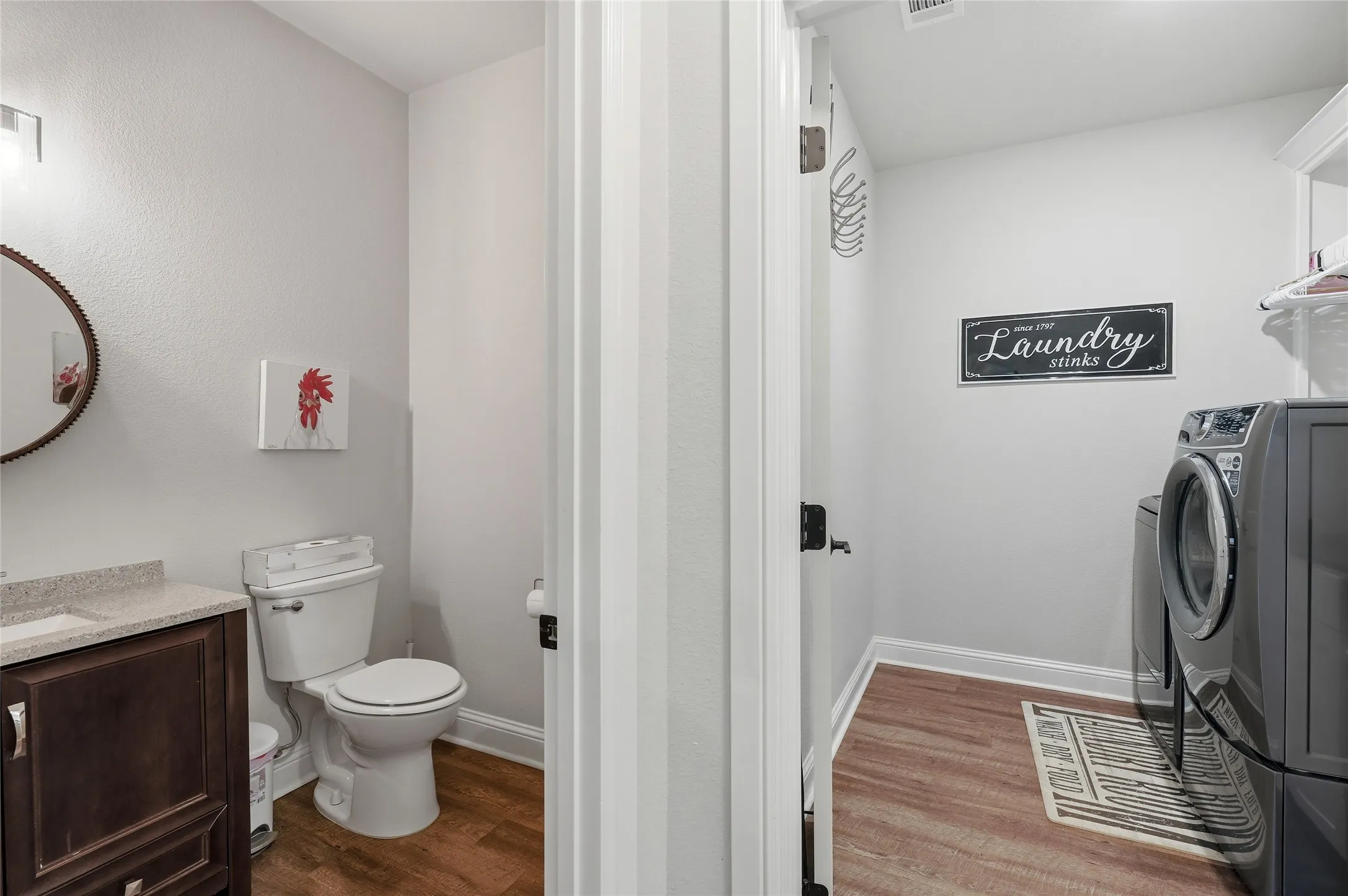 Half Bath next to the Utility Room with built in cabinets