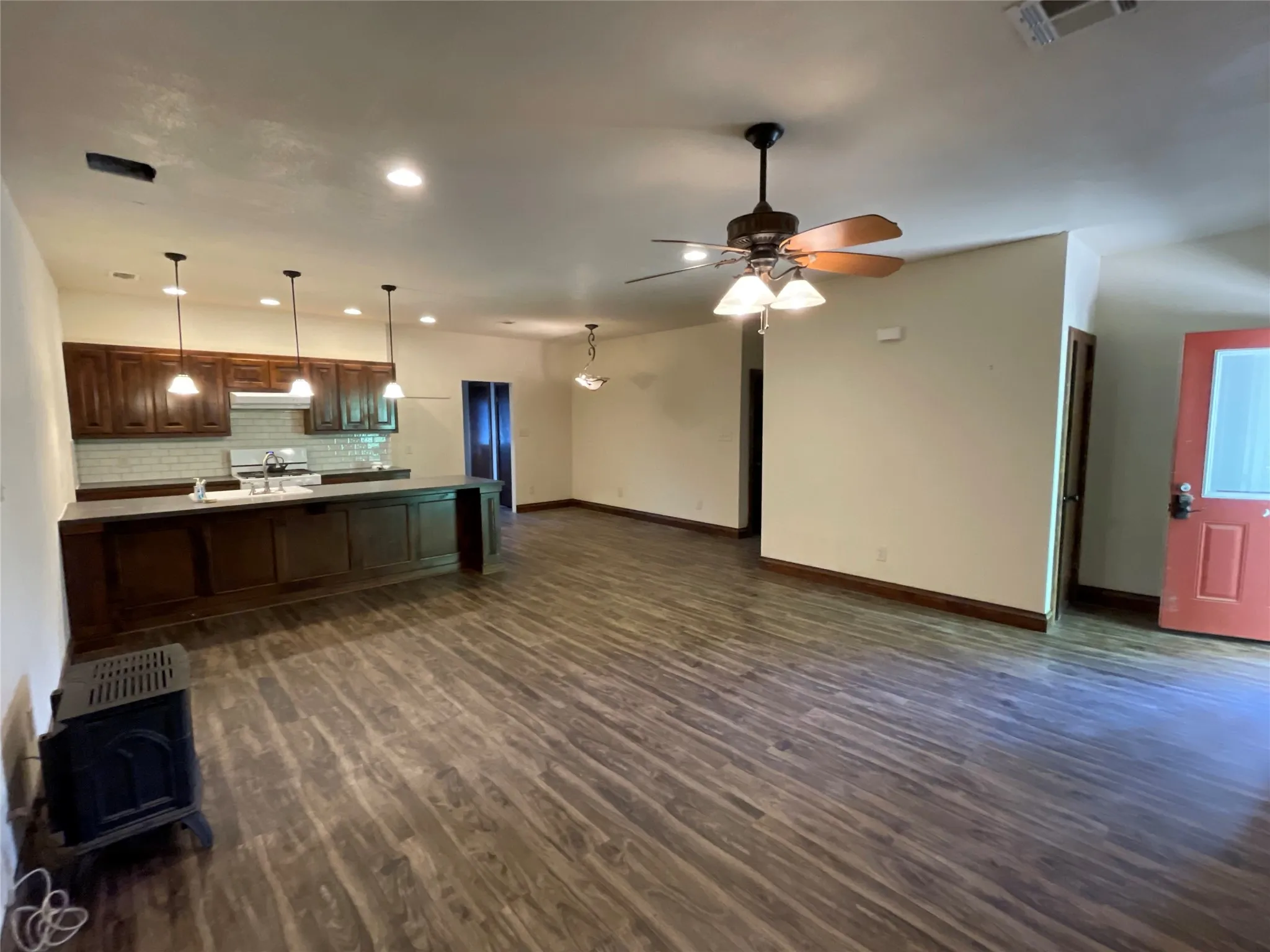 Living area facing kitchen and dining