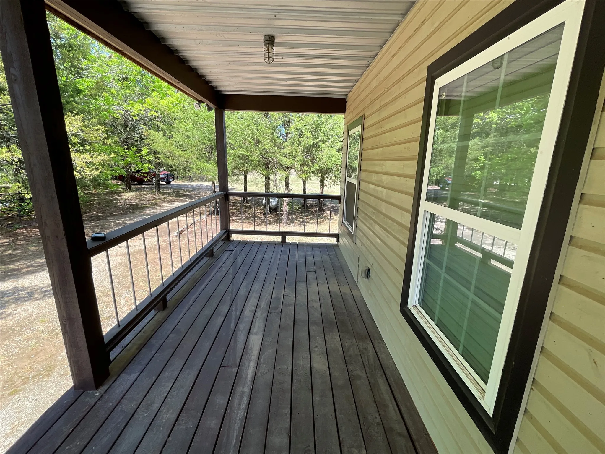 Huge 35x8 front porch with railing all around