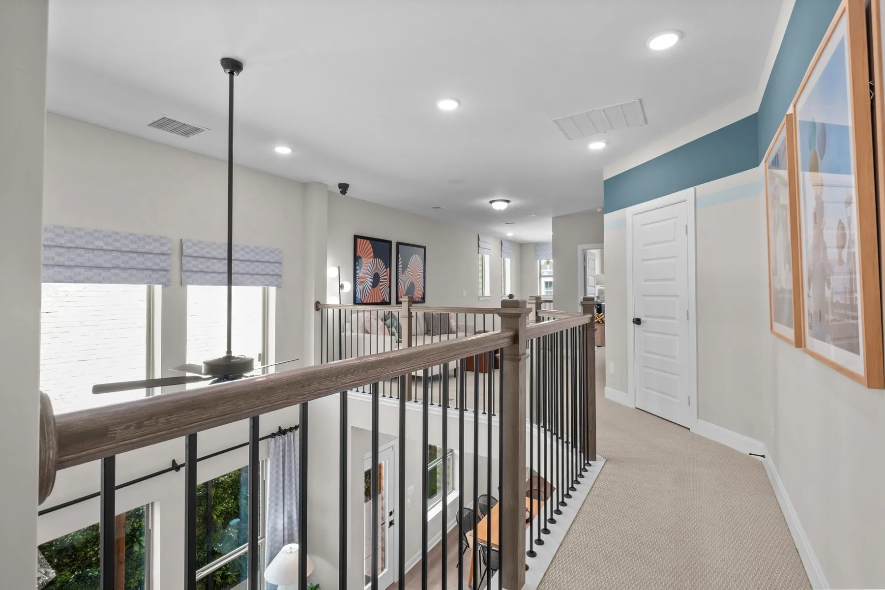 Corridor featuring light colored carpet and recessed lighting