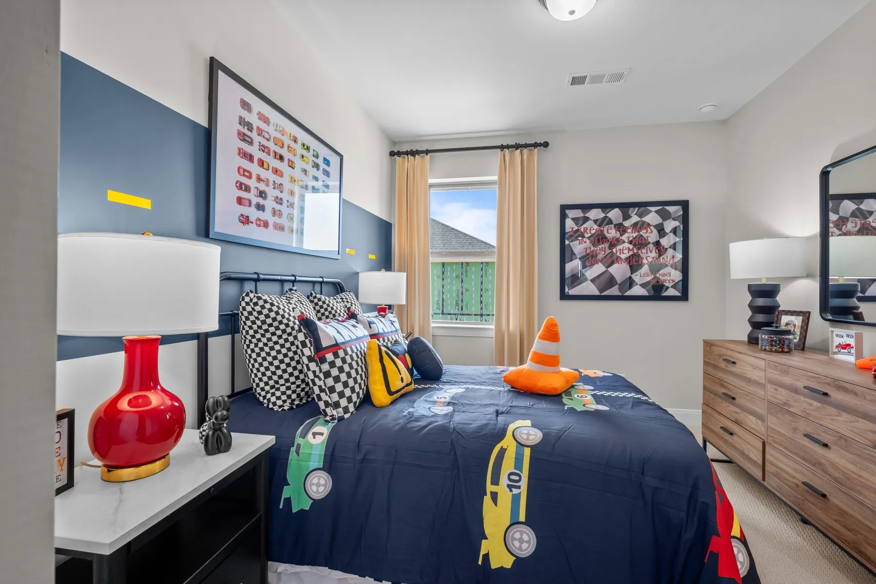 Bedroom featuring light carpet
