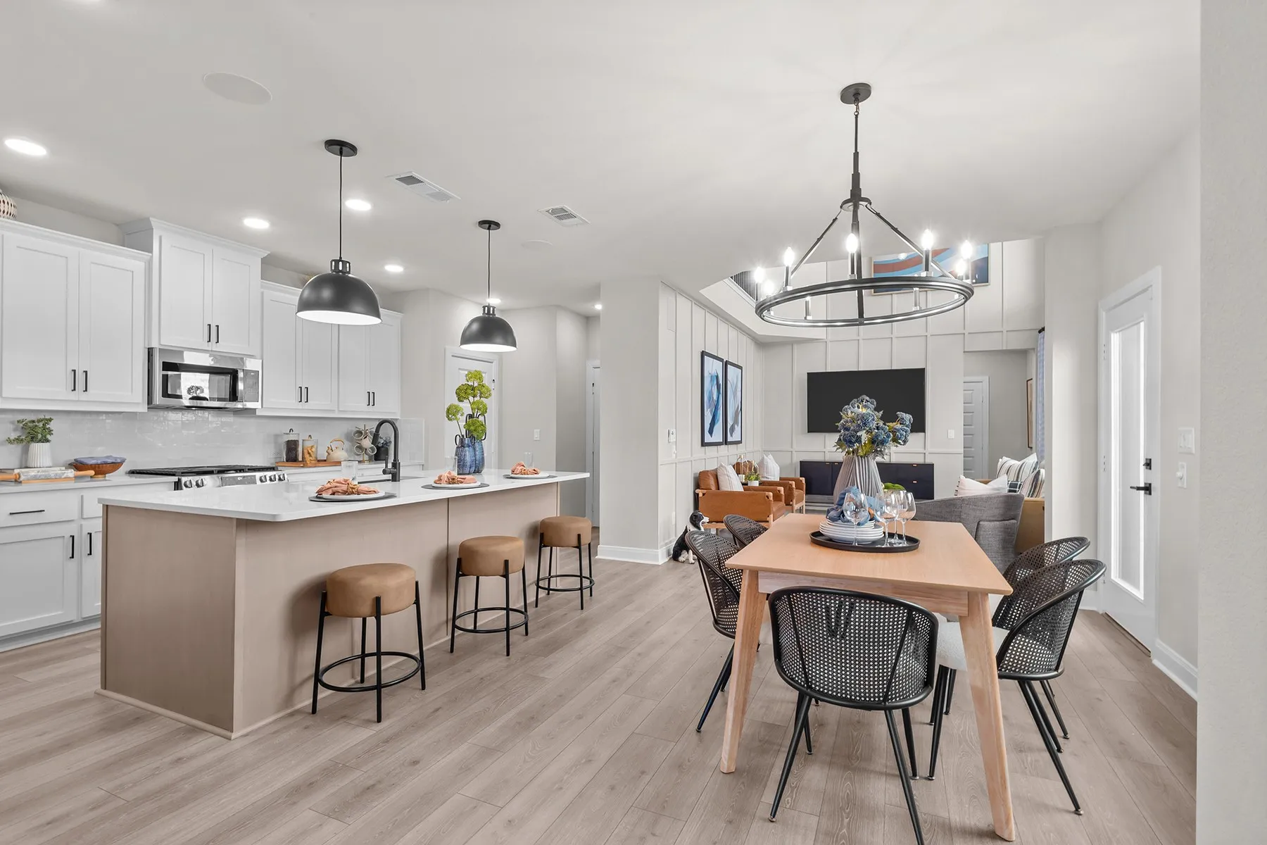 Dining room with hanging lights and light wood-type flooring