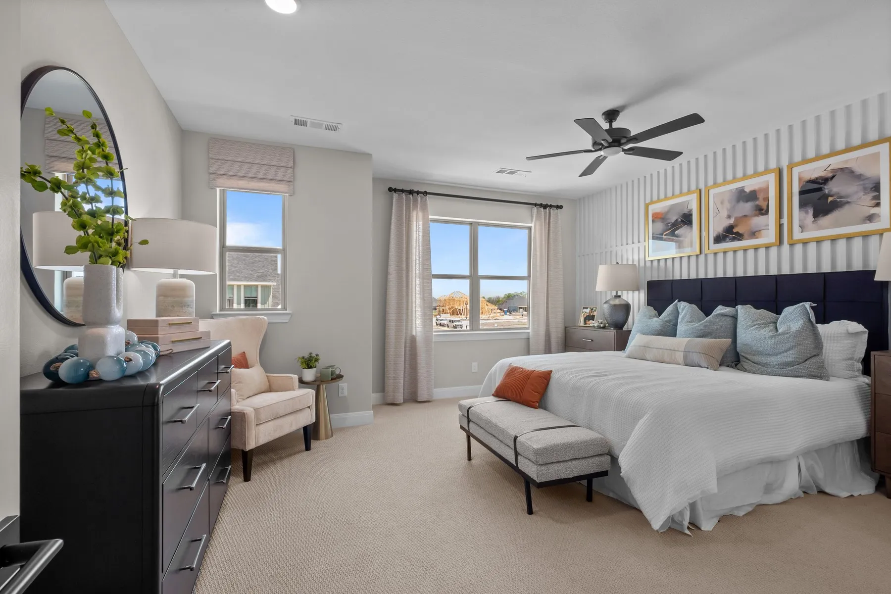 Bedroom with light carpet, a ceiling fan, and wallpapered walls
