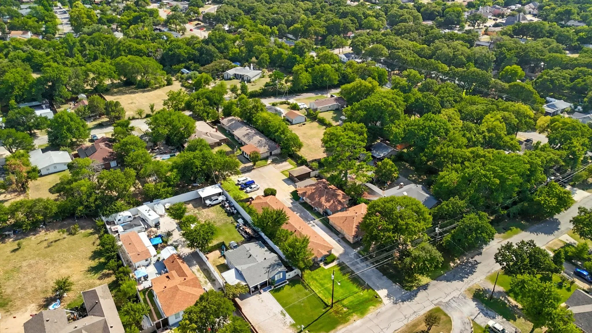 View of property location with nearby suburban area
