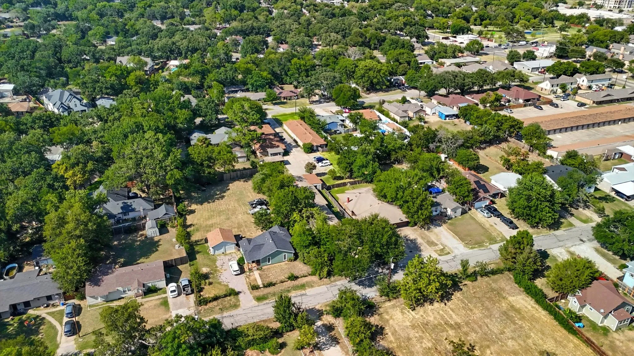 Aerial overview of property's location with nearby suburban area