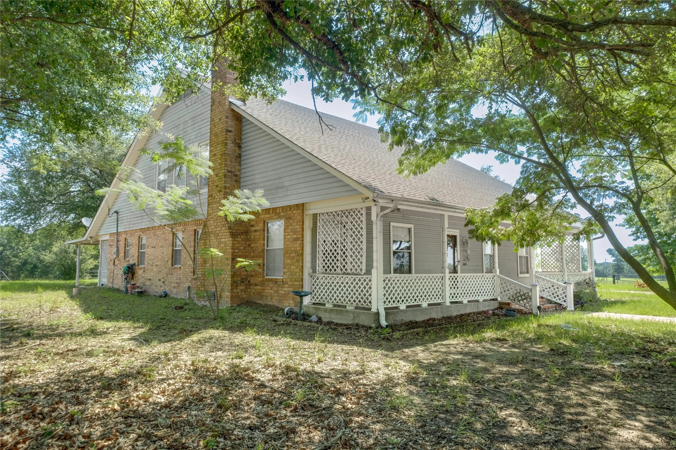Exterior features brick and siding construction with a gabled roof