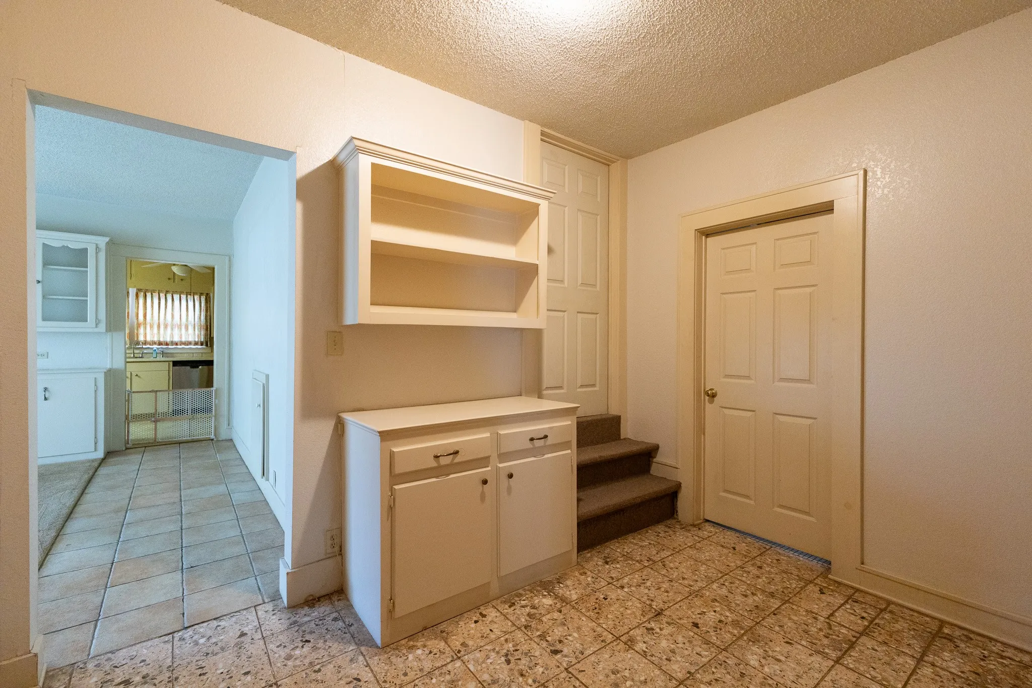 Hallway with stairs going to second floor
