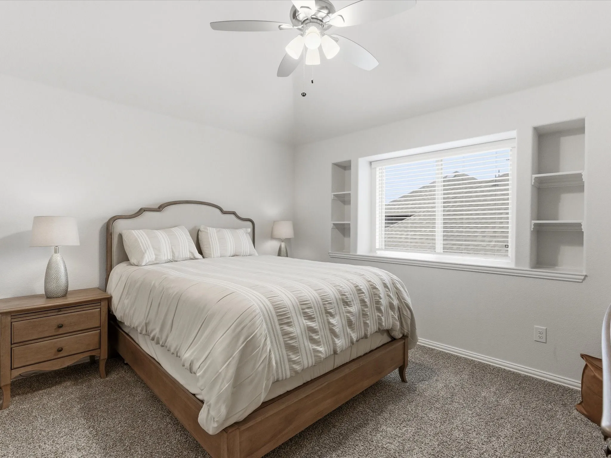 Bedroom featuring ceiling fan, dark colored carpet, and lofted ceiling