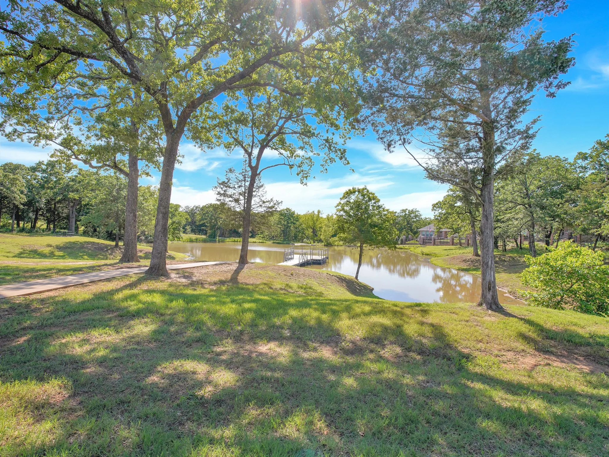 View of grassy yard with a water view