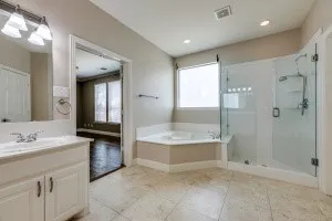Full bath featuring a garden tub, a stall shower, vanity, and recessed lighting