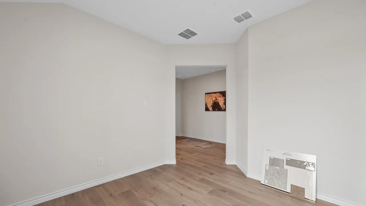 Spare room with light wood finished floors and baseboards