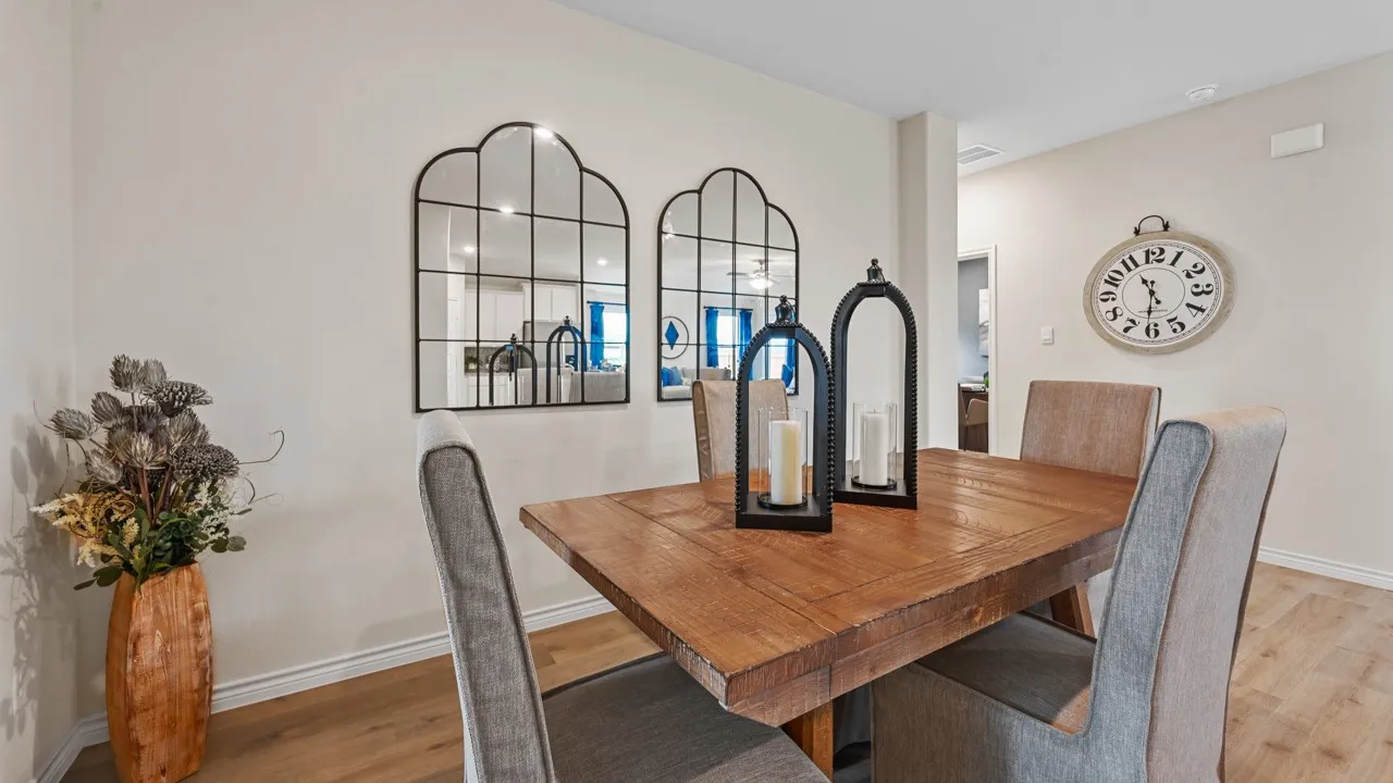 Dining area featuring light wood-style flooring and baseboards