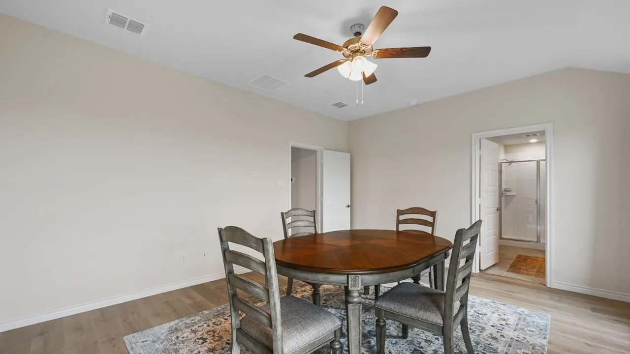 Dining room featuring light wood-style floors and a ceiling fan