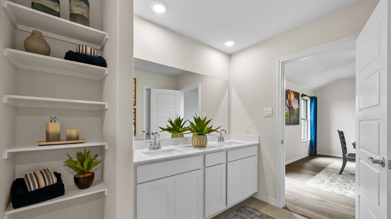 Bathroom featuring double vanity and recessed lighting