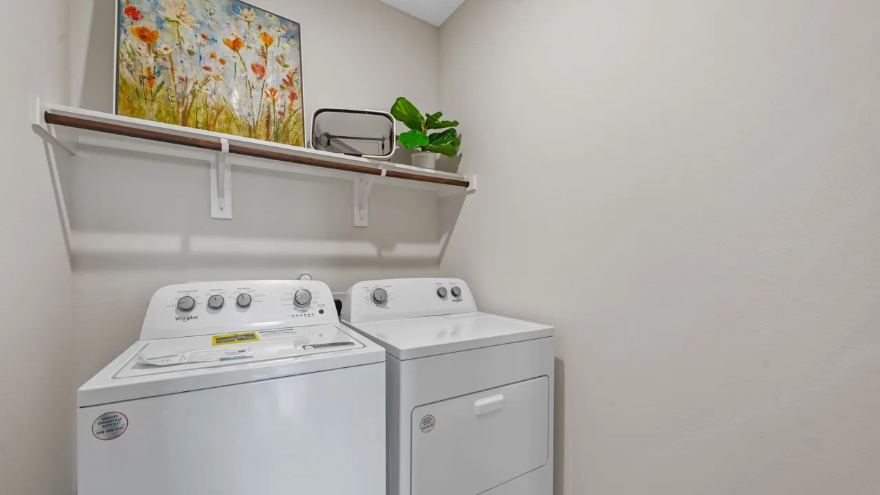 Laundry area featuring independent washer and dryer
