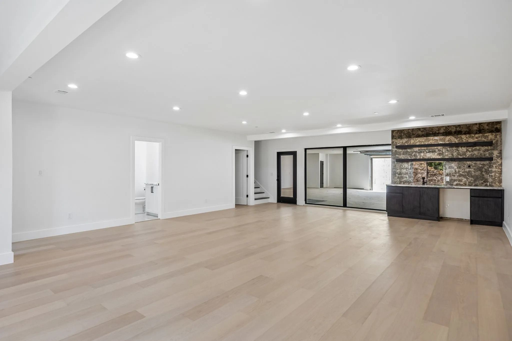 1st Level Entertaining Area with Wet Bar and Views to Showcase Garage!