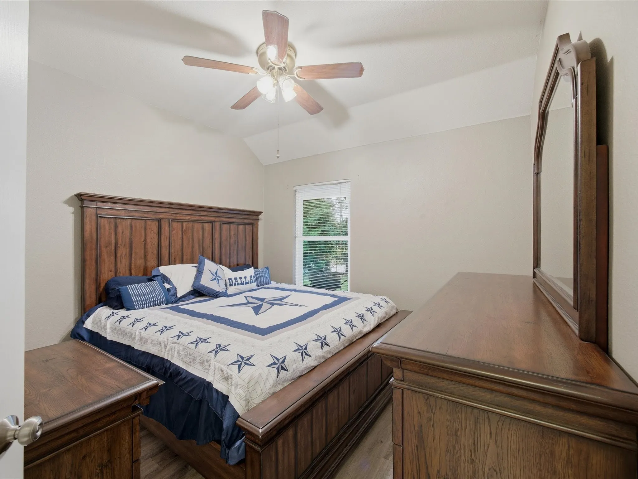 Bedroom 3 featuring lofted ceiling and ceiling fan
