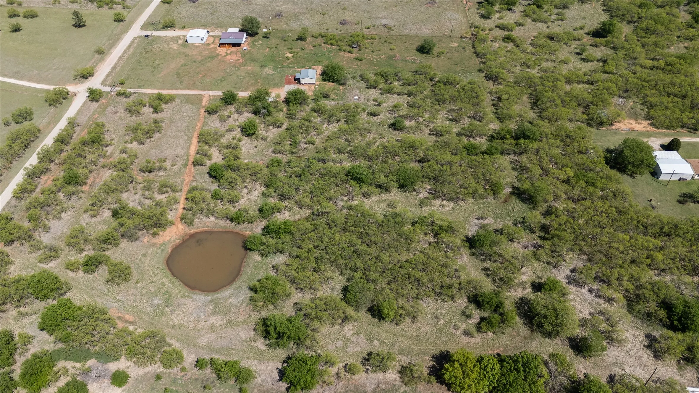 Aerial view of 10 acres with Home, Barndo, and Shop
