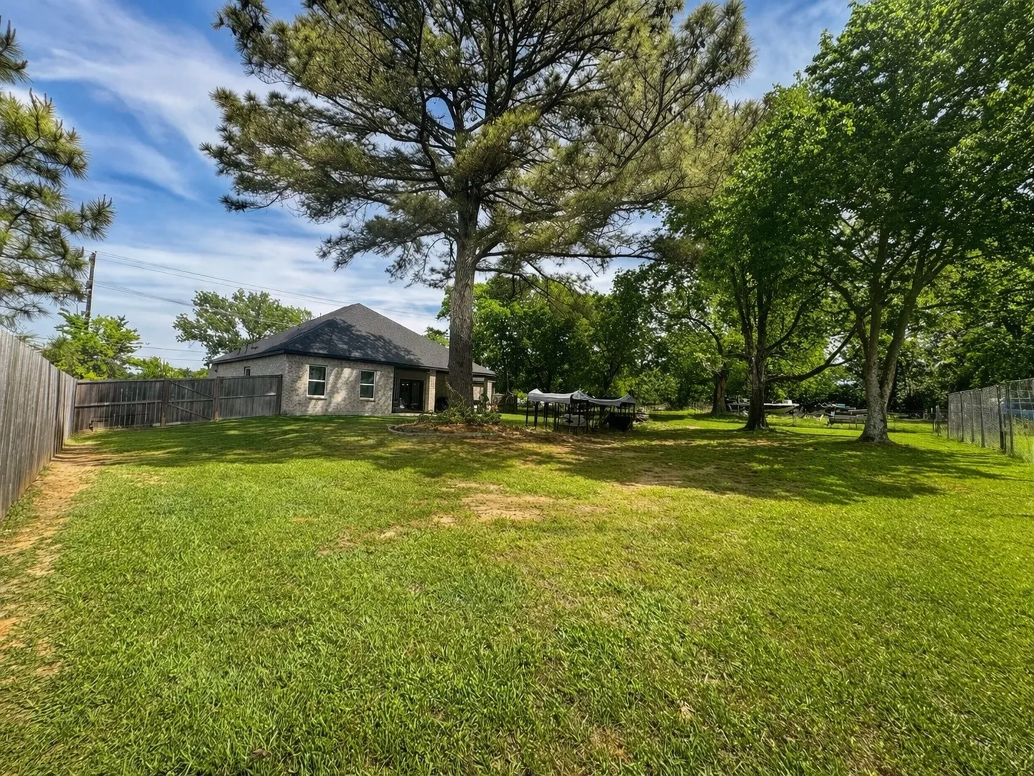View of fenced backyard