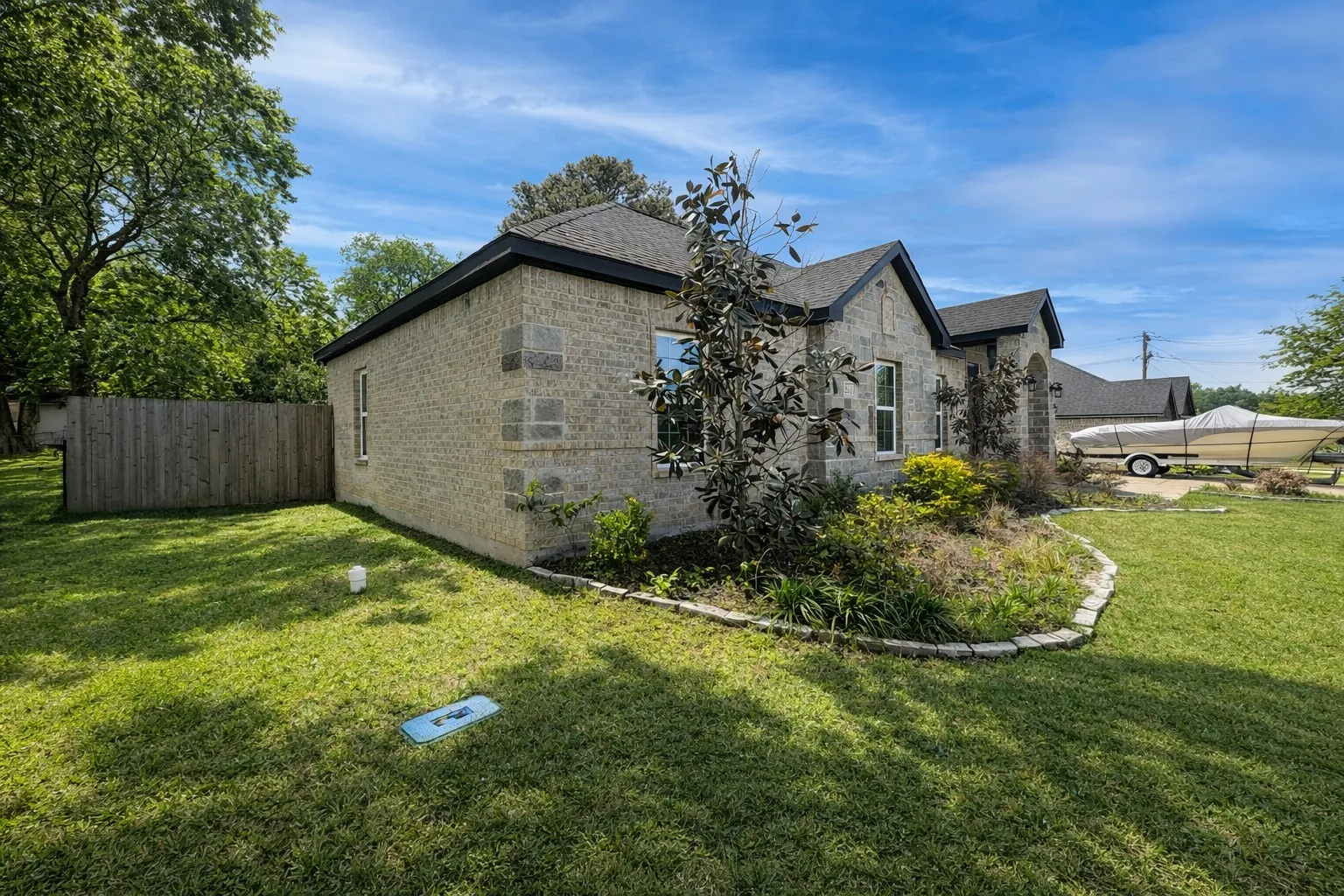 View of home's exterior featuring stone siding and brick siding