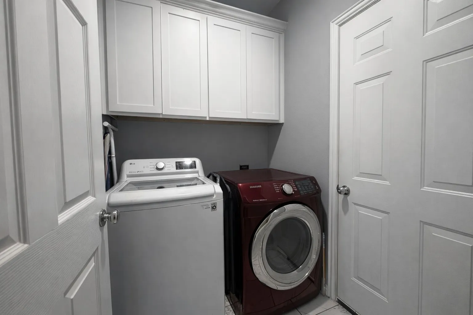 Laundry room with washer and dryer and cabinet space