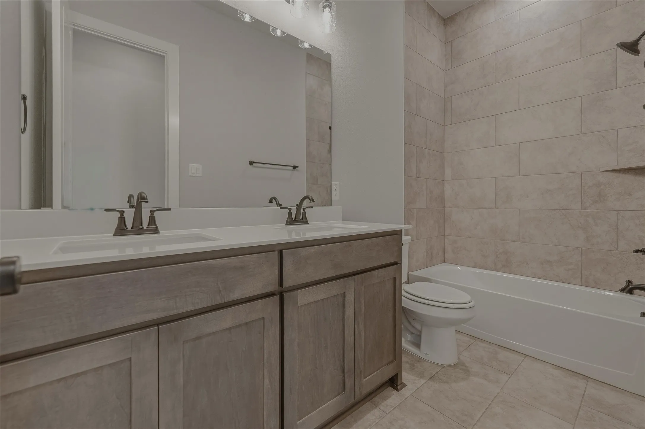 Dual vanity with integrated sinks and brushed nickel faucets